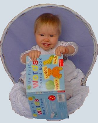 Baby with book in a basket